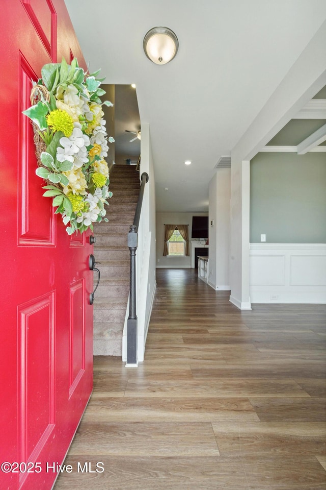 entryway with stairway, wood finished floors, ceiling fan, and recessed lighting
