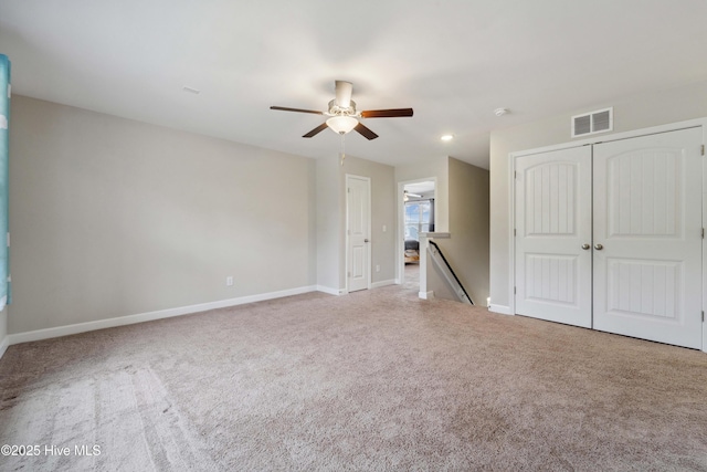 unfurnished bedroom with carpet, baseboards, a ceiling fan, a closet, and recessed lighting
