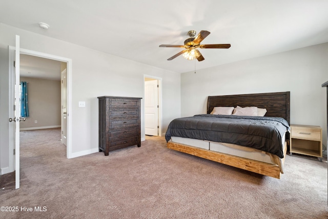 carpeted bedroom with baseboards and ceiling fan