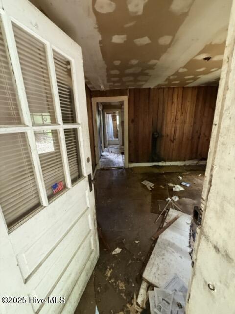 misc room with wooden walls