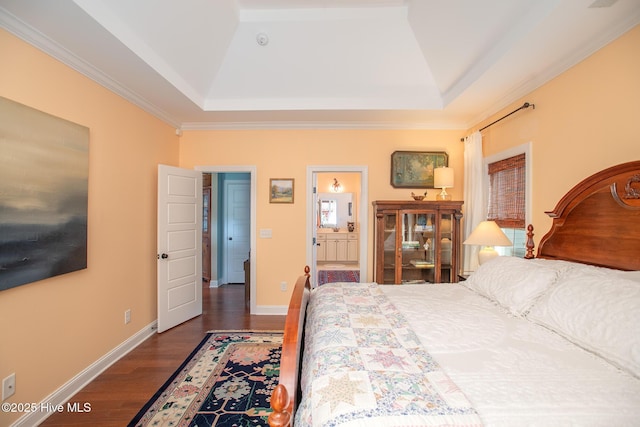 301 Hedrick St, Beaufort, NC 28516 - bedroom featuring a raised ceiling, wood finished floors, baseboards, ornamental molding, and ensuite bath