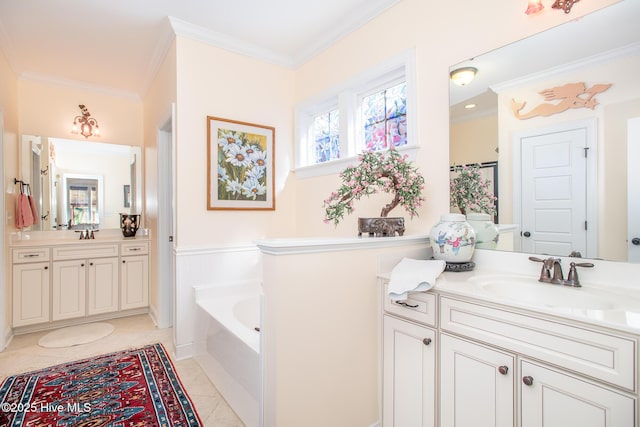 301 Hedrick St, Beaufort, NC 28516 - full bath featuring crown molding, a bath, two vanities, and a wainscoted wall