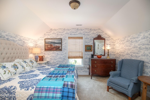 301 Hedrick St, Beaufort, NC 28516 - carpeted bedroom featuring vaulted ceiling and wallpapered walls