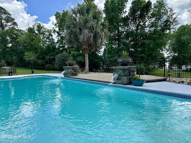 102 Silver Creek Landing Rd, Swansboro, NC 28584 - view of swimming pool with a patio area and view of wooded area