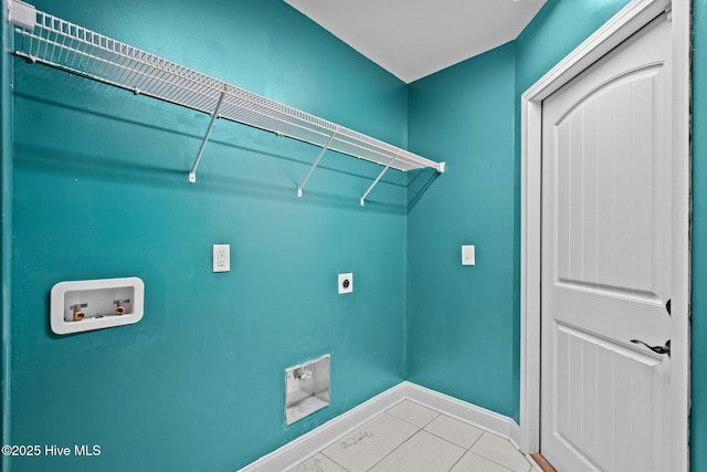 clothes washing area with electric dryer hookup, hookup for a washing machine, and baseboards