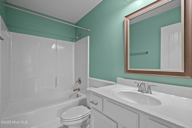 bathroom with toilet, tub / shower combination, and vanity