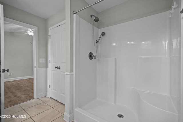 bathroom with a shower, ceiling fan, and tile patterned floors