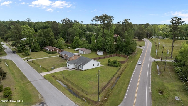aerial overview of property's location with a heavily wooded area