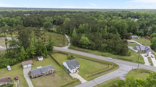 view of property location with a heavily wooded area