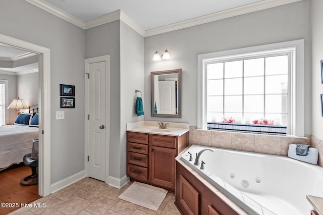 ensuite bathroom with crown molding, a whirlpool tub, vanity, and baseboards