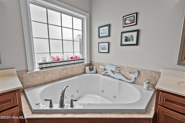bathroom featuring vanity and a whirlpool tub