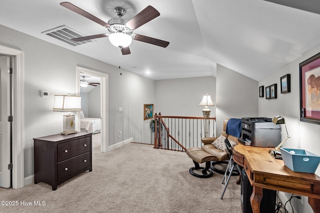 office with ceiling fan, light carpet, baseboards, and vaulted ceiling