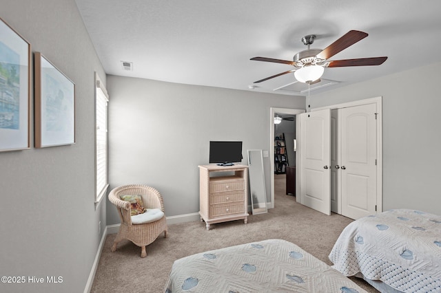 carpeted bedroom featuring baseboards, ceiling fan, and a closet