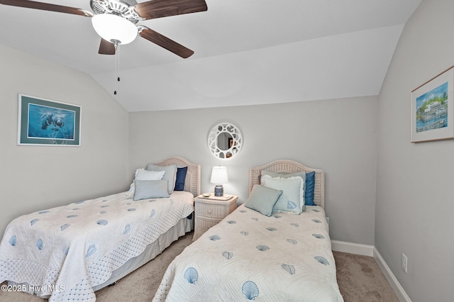 bedroom with carpet, vaulted ceiling, baseboards, and a ceiling fan