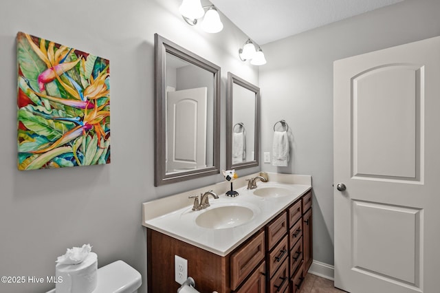 bathroom featuring double vanity and tile patterned floors