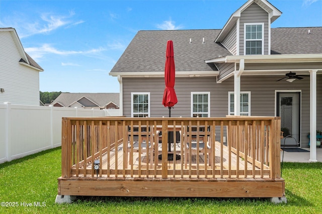 rear view of property with roof with shingles, fence, ceiling fan, and a wooden deck