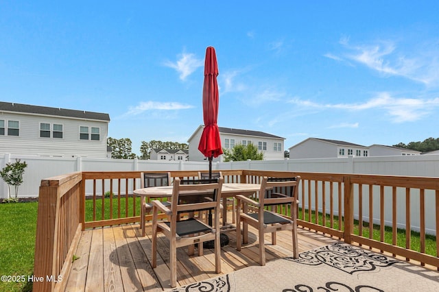 wooden terrace with outdoor dining space