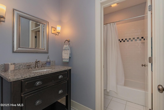 full bath featuring vanity, tile patterned floors, shower / tub combo with curtain, and baseboards