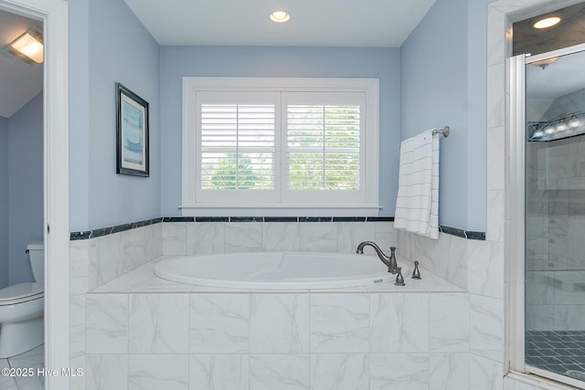 bathroom featuring toilet, a shower stall, a garden tub, and recessed lighting