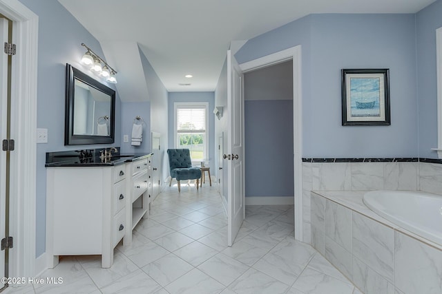 bathroom with marble look tiles, baseboards, a bath, vanity, and recessed lighting