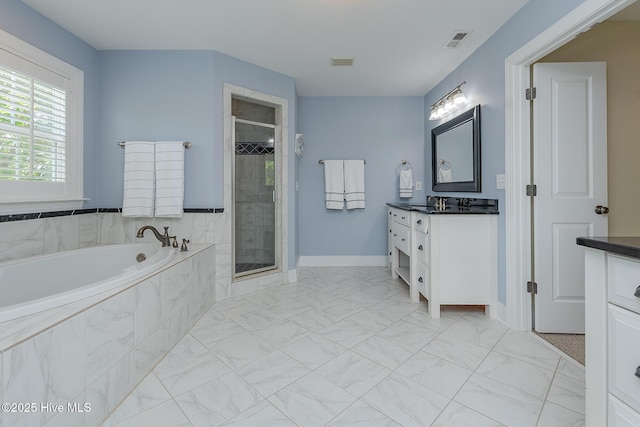full bath with marble finish flooring, a stall shower, vanity, a bath, and baseboards