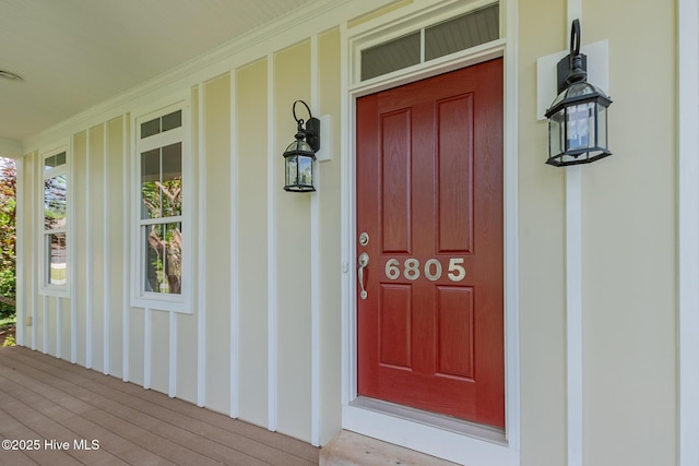 doorway to property featuring covered porch