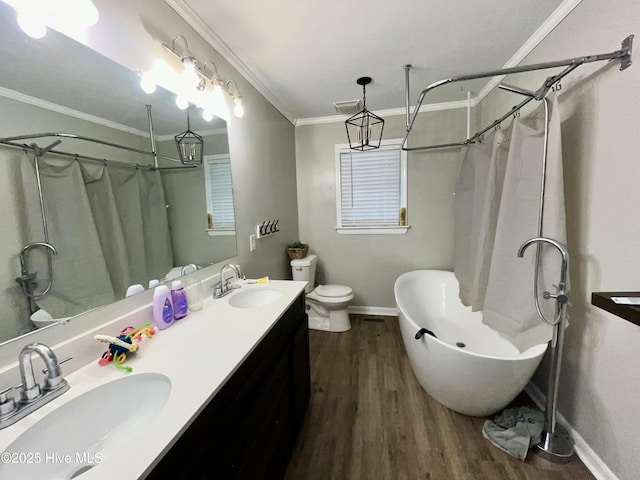 full bath featuring crown molding, wood finished floors, toilet, curtained shower, and a bath
