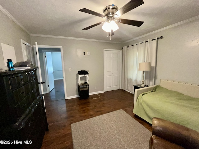 bedroom featuring wood finished floors, crown molding, ceiling fan, and baseboards