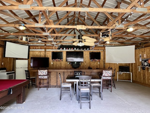view of patio / terrace with a ceiling fan and a bar
