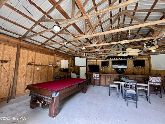 playroom featuring pool table, concrete floors, and vaulted ceiling