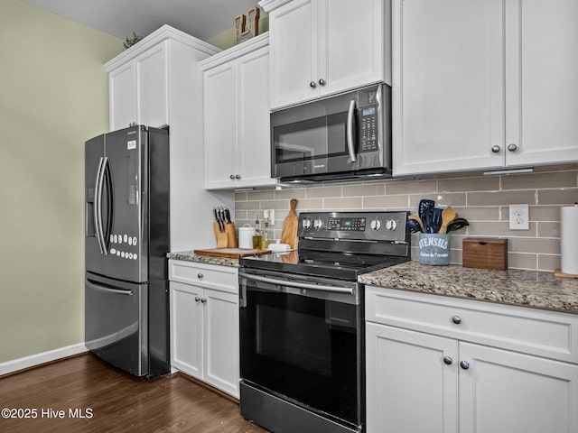 kitchen featuring appliances with stainless steel finishes, dark wood-type flooring, baseboards, and white cabinetry