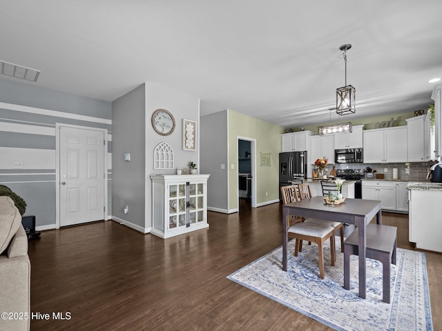 bedroom with carpet, baseboards, a nursery area, and ceiling fan