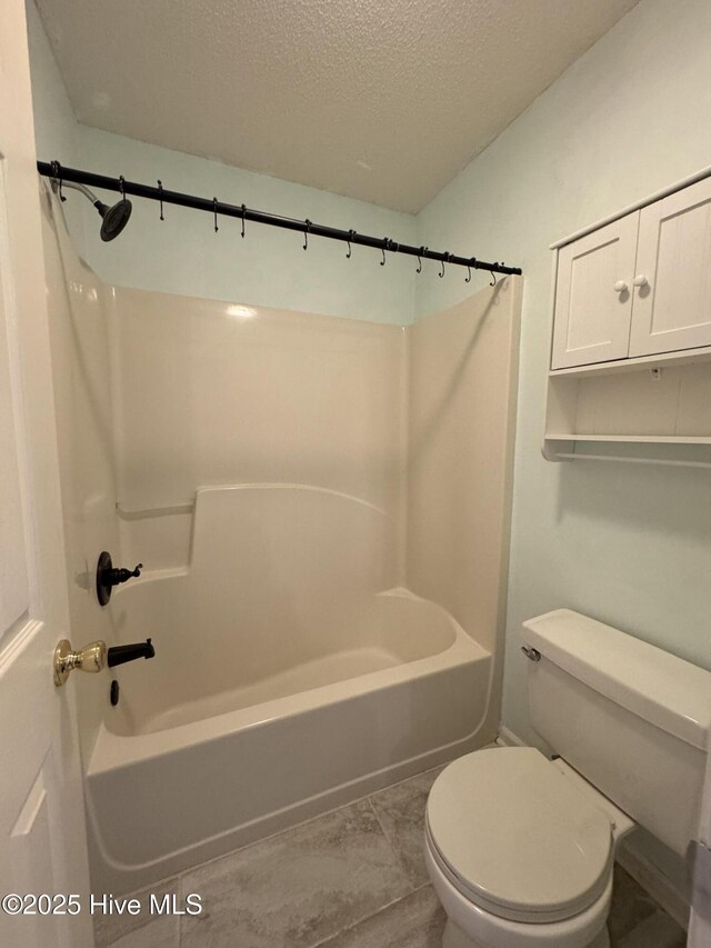 126 W Victoria Ct Unit D, Greenville, NC 27834 - full bathroom with toilet, a textured ceiling, and shower / washtub combination