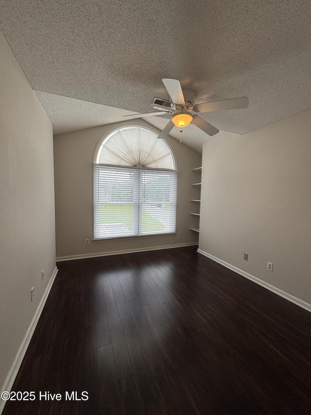 126 W Victoria Ct Unit D, Greenville, NC 27834 - unfurnished room with a textured ceiling, wood finished floors, vaulted ceiling, a ceiling fan, and baseboards