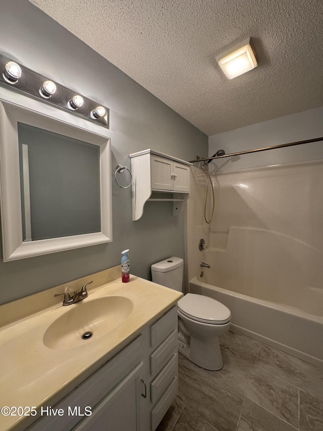 126 W Victoria Ct Unit D, Greenville, NC 27834 - full bathroom with a textured ceiling, toilet, vanity, and shower / tub combination