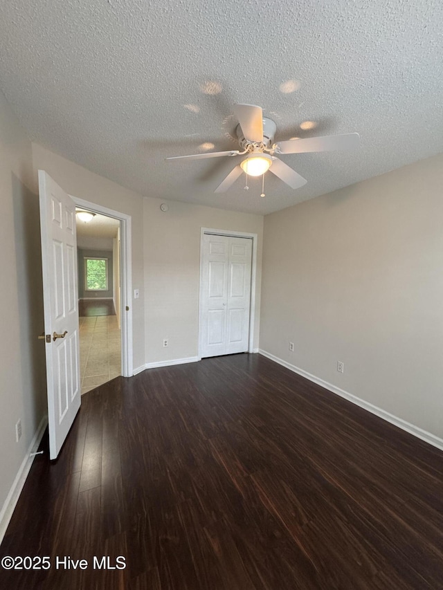 126 W Victoria Ct Unit D, Greenville, NC 27834 - unfurnished room featuring wood finished floors, ceiling fan, a textured ceiling, and baseboards