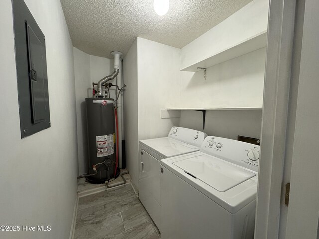 126 W Victoria Ct Unit D, Greenville, NC 27834 - washroom with electric panel, a textured ceiling, gas water heater, separate washer and dryer, and light marble finish flooring