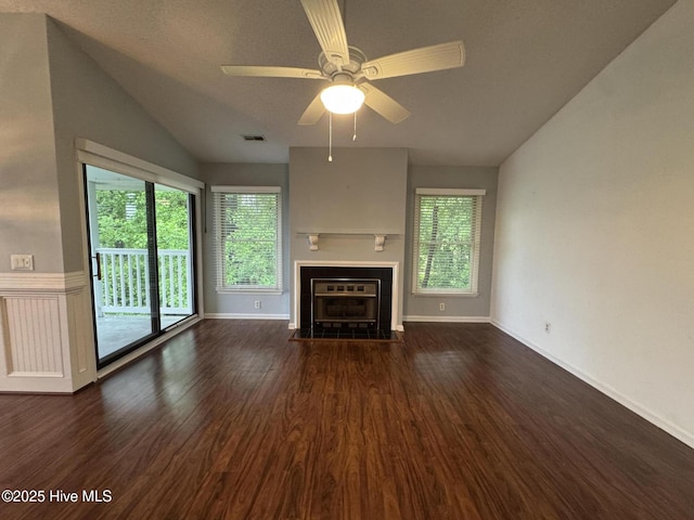 126 W Victoria Ct Unit D, Greenville, NC 27834 - unfurnished living room featuring lofted ceiling, healthy amount of natural light, a tile fireplace, wood finished floors, and a ceiling fan