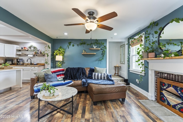 102 E 9th St, Washington, NC 27889 - living area featuring ceiling fan, hardwood / wood-style flooring, recessed lighting, a fireplace with flush hearth, and baseboards