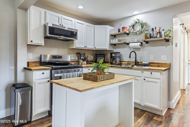102 E 9th St, Washington, NC 27889 - kitchen featuring butcher block countertops, appliances with stainless steel finishes, white cabinets, and recessed lighting