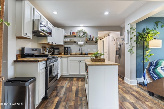 102 E 9th St, Washington, NC 27889 - kitchen with wood counters, appliances with stainless steel finishes, a sink, open shelves, and dark wood-type flooring