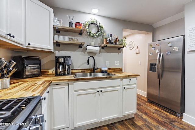 102 E 9th St, Washington, NC 27889 - kitchen featuring butcher block counters, stainless steel appliances, a sink, open shelves, and white cabinets