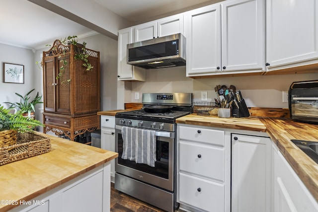102 E 9th St, Washington, NC 27889 - kitchen featuring butcher block countertops, appliances with stainless steel finishes, crown molding, and white cabinetry