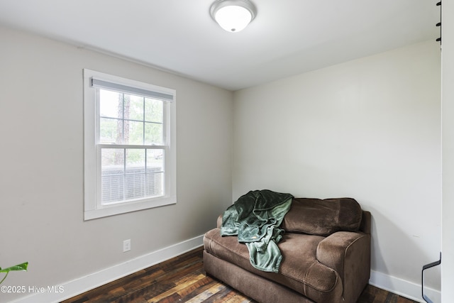 102 E 9th St, Washington, NC 27889 - living area with baseboards and dark wood-type flooring