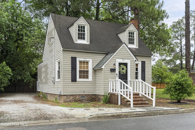 102 E 9th St, Washington, NC 27889 - cape cod home featuring fence, roof with shingles, crawl space, and a chimney