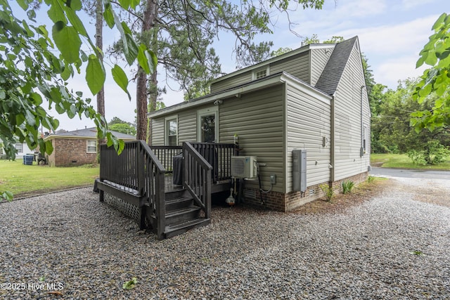 102 E 9th St, Washington, NC 27889 - back of property with a deck and a shingled roof