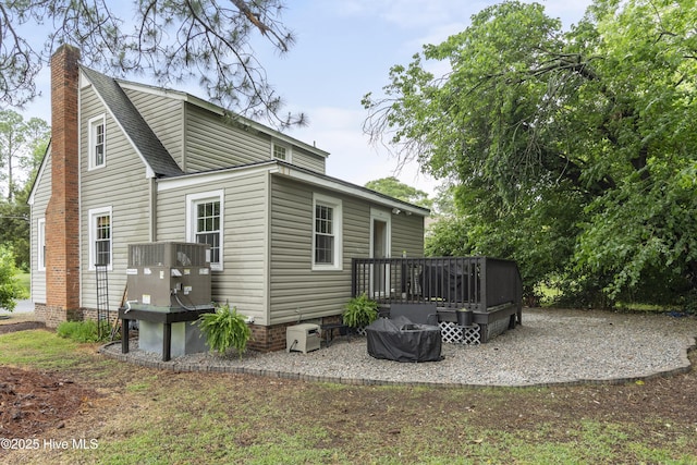 102 E 9th St, Washington, NC 27889 - back of property with a deck, a chimney, and central AC