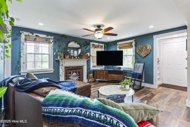 102 E 9th St, Washington, NC 27889 - living room with ceiling fan, wood finished floors, baseboards, recessed lighting, and a brick fireplace