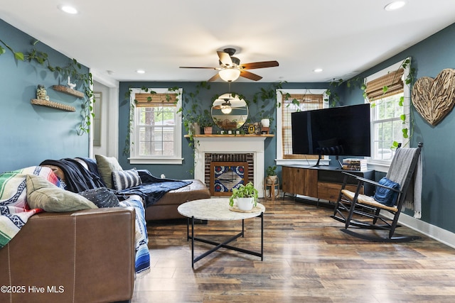 102 E 9th St, Washington, NC 27889 - living room with wood finished floors, ceiling fan, recessed lighting, a fireplace, and baseboards
