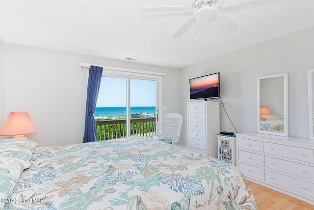 6301 Ocean Dr, Emerald Isle, NC 28594 - bedroom featuring access to outside, light wood-style floors, and ceiling fan